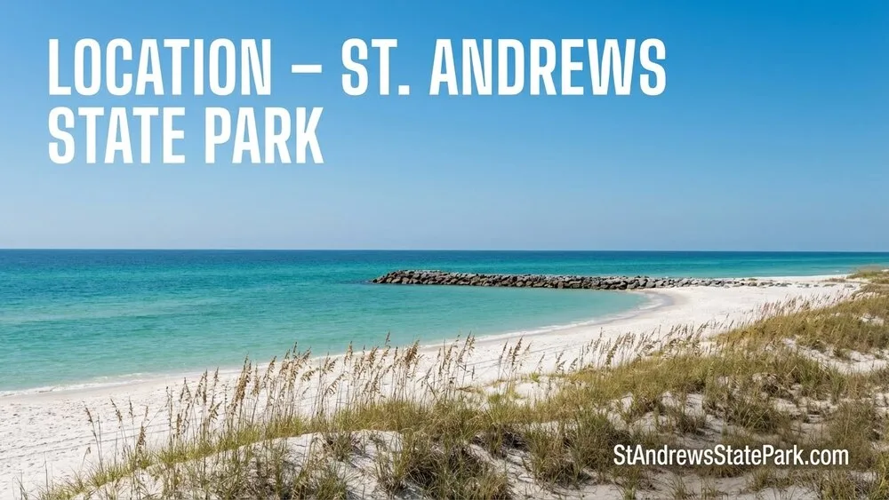 St. Andrews State Park features a sandy beach with clear blue water and lush greenery along Panama City Beach, Florida.