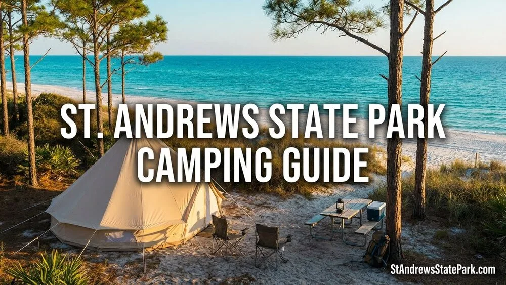A tent set up on the sandy beach at St. Andrews State Park with the ocean in the background.